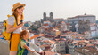 © BooFamily - Happy family traveling. Young red-haired mother and little excited daughter looking on the Porto city, Portugal