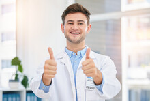 Medical, Thank You And Thumbs Up By Doctor In A Hospital Office Feeling Happy And Excited In A Clinic. Support, Medicine And Portrait Of Man Healthcare Professional Satisfied In Agreement With Health