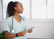 © Meeko Media - Portrait of a young Black female doctor, smiling with digital tablet, eHealth