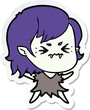 sticker of a annoyed cartoon vampire girl