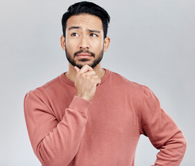 Aufkleber - Confused, thinking and Asian man with ideas, decision and thoughtful against grey studio background. Japan, male and guy with wonder, opportunity and confused with thoughts, contemplation and future