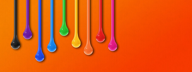 Wall Mural - Colorful ink drops on orange background. Horizontal banner