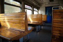 Old Empty Wagon Of Train. Wooden Seats In An Empty Coach Of Train