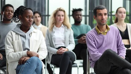 Wall Mural - Different groups of people communicate with each other during business seminar or training.