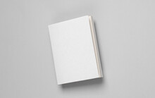 Book Or Notepad Mockup With White Cover On Gray Background. Template For Design