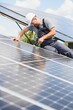 © Serhii - A man working at solar power station.