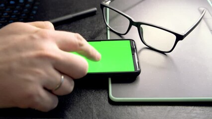 Aufkleber - Woman using mobile phone sitting on a sofa at home. 4k video footage with green screen smartphone