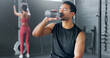 © N Felix/peopleimages.com - Man, tired and drinking water in gym workout, training and exercise break for energy recovery and muscle rest. Personal trainer, fitness coach and drink for wellness, sports health and weight loss