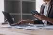 © ARMMY PICCA - Businesswoman or accountant working Financial investment on calculator, calculate, analyze business and marketing growth on financial document data graph, Accounting, Economic, commercial concept.