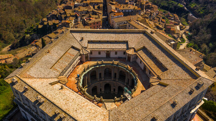 Aerial view of the Villa Farnese, a pentagonal mansion in Caprarola, near Viterbo, Italy. It is a massive Renaissance and Mannerist construction. It is built on a five-sided plan in reddish gold stone