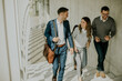© BGStock72 - Group of corporate business professionals climbing at stairs in office corridor
