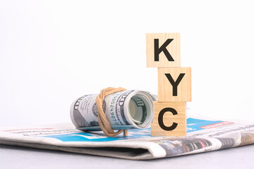 Wall Mural - text KYC on wooden cubes over blur background with copy space, financial concept background