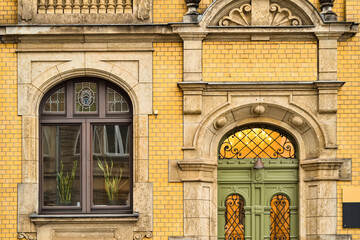 Wall Mural - view of brick building with wooden window and door
