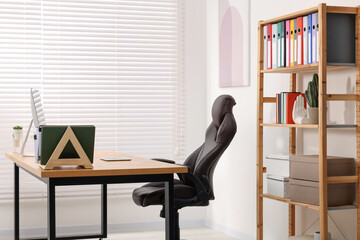 Poster - Desk and comfortable chair in modern office. Interior design