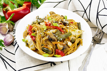 Wall Mural - Spaghetti buckwheat with vegetables in plate on light board