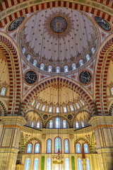 Wall Mural - Interior of Fatih Mosque, Ottoman mosque in the Fatih district of Istanbul, with a huge decorated domes. Arabic text as decor (verses from Koran, muslim Holy book). Istanbul, Turkey