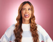 Funny, face and goofy woman tongue out feeling happy, playful and excited isolated in a studio purple background. Comic, joke and head of a young and crazy female wink for humor or happiness