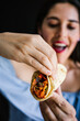 © Marcos - Mexican woman eating tacos al pastor, mexican food in Mexico Latin America