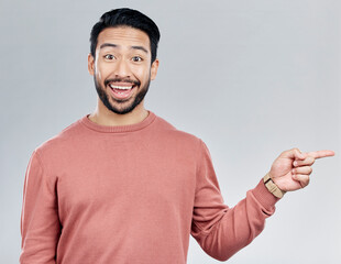 Aufkleber - Excited, gesture and portrait of Indian man pointing at mockup and product placement isolated on white background. Promotion, information and person showing deal space in studio with launch idea.