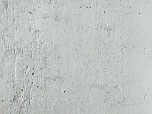 Grunge Texture Of An Old Weathered Plaster Surface. Concrete Gray Wall Background With Scratches And Cracks.