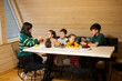 © AS Photo Family - Mother with four children eat fruits in wooden country house on weekend.