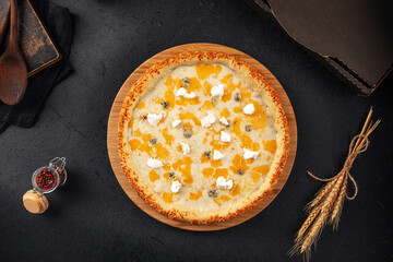 Wall Mural - Gourmet four cheese pizza with cheddar and gorgonzola