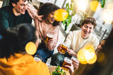 Fototapeta Londyn - Group of happy people drinking beer sitting at table pub restaurant-Young friends enjoying together at brewery bar having fun and toasting glasses- Food and beverage lifestyle concept