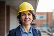 © asife - Portrait of a female construction engineer at construction site smiling