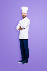 Canvas Print - Full size body portrait of joyful positive chef cook with stubble in beret, having his arms crossed, isolated over grey background, looking at camera