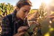 © nenetus - Shot of winegrower woman picking grapes while watching the growth of the crop in the vineyard. Generative Ai