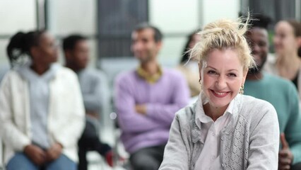 Wall Mural - young attractive business woman, teacher or trainer-mentor, looking at the camera