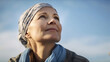 © nenetus - Beautiful mature woman looking for the horizon while relaxing in nature. Generative AI