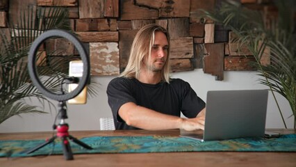 American freelancer home distant work. Busy person typing computer macbook cowork cafe. Boss man look screen monitor. Male guy sit study office. Long hair people use laptop. Online remote internet job