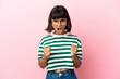 © luismolinero - Young mixed race woman isolated on pink background frustrated by a bad situation