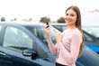 © luismolinero - Young pretty blonde woman holding car keys at outdoors and pointing it