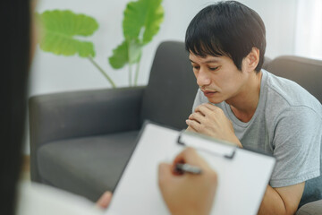 Man counseling with a doctor to rehab mental health after-work stress.