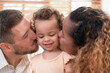 © Wosunan - Parents and children relax in the living room of the house. Watch baby happily play with his favorite toy.