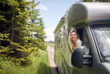 Fototapeta Panele - freedom journey travel with off road.Girl on  vacation travel RV, holiday trip