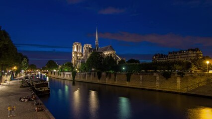 Poster - Cathedral Notre Dame de Paris day to night transition timelapse after sunset in France. View from Bridge of the Archbishopric. Boat station and waterfront. Architecture at evening with dramatic sky.