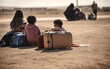 Children with luggage sit on a barren landscape, depicting the stark reality of refugees