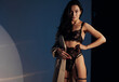 © Stanislav - Young sexy woman poses in black lacy lingerie in BDSM style and unbuttoned cloak.
