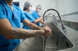 © Svitlana - Team of surgeons thoroughly washes their hands before surgery