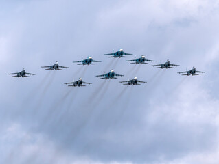 Wall Mural - MOSCOW, RUSSIA - MAY 7, 2021: Avia parade in Moscow. su-35 and su-34 and su-30 in the sky on parade of Victory in World War II in Moscow, Russia