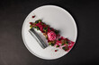 top view on a Gourmet and gastronomic fish dish isolated on a black background,culinary arts
