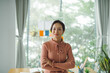 © Marc Tran/Stocksy - Attractive young businesswoman with a lovely smile standing