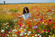 © warpaintcobra - Woman in a field in the spring time generative AI