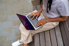 Anonymous Student With Laptop Outdoors 
