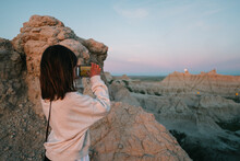 Young Girl Looks At Lunar Eclipse In Badlands National Park 
