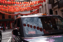 Chinese Lamps In The Street With Taxi Cab
