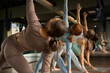 © Tatiana Timofeeva/Stocksy - group yoga classes